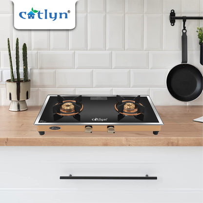 Catlyn - 2 Burner Side Mirror Glass Gas Stove with Rose Gold SS Mirror Finish Frame, Round Pan Support, Brass Top (WEGO - 2501)